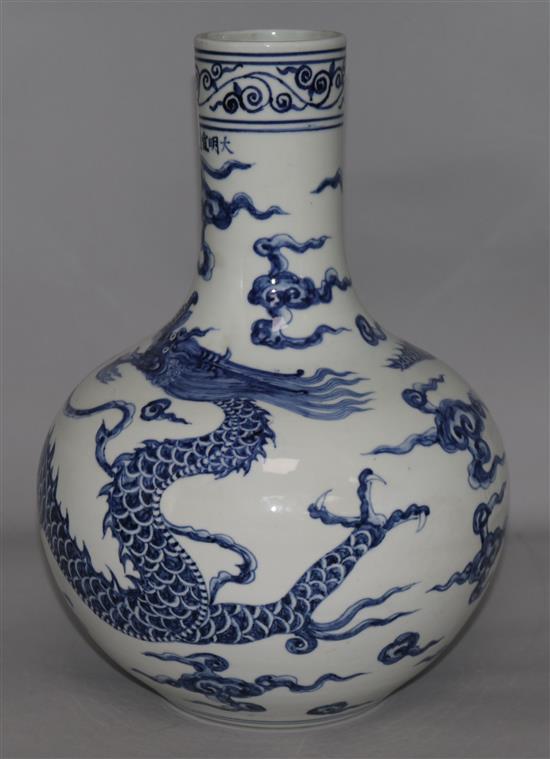 A blue and white dragon vase